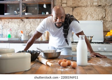 african man in the kitchen of his house - Shutterstock ID 2200196911
