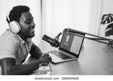 African Man Live Streaming Podcast Session At Home Studio - Focus On Microphone - Black And White Editing