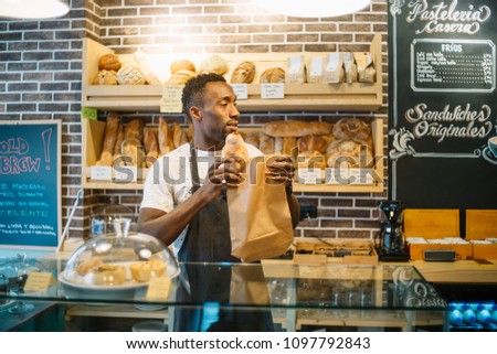 Similar – Image, Stock Photo African man works in pastry shop.