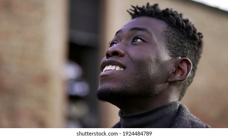 African Man Taking A Deep Breath Outside At Park. Close-up Person Meditating