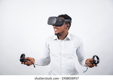 african man using a vr headset and holding controllers for gaming