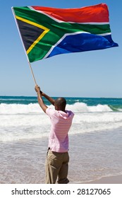 African Man Waving A South African Flag On Beach, New South Africa 2010 World Cup Concept