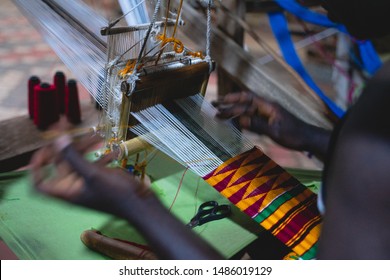 African man weaving Kente Cloth
