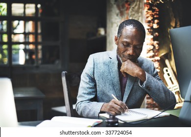 African Man Working Determine Workspace Lifestyle Concept - Powered by Shutterstock