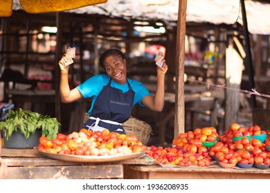 African Market Woman Holding Money, Feeling Excited And Happy