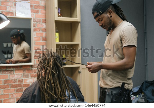 African Master Hairdresser Making Dreadlocks Young Stock Image