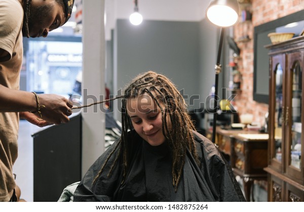 African Master Hairdresser Making Dreadlocks Young Stock Photo