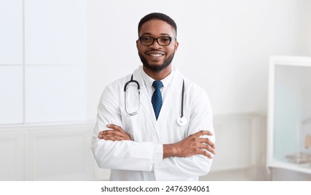 African Medical Doctor Looking At Camera During Conference In Board Room - Powered by Shutterstock