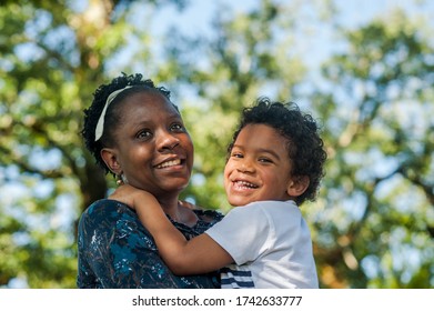 African Mom Happily Hugging Her Child Stock Photo 1742633777 | Shutterstock