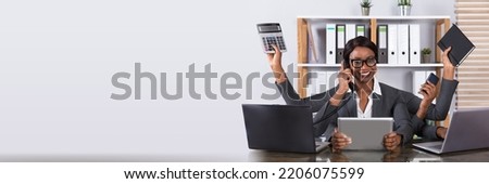 African Multitasking Woman In Office At Work