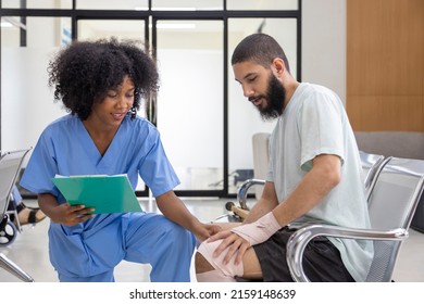 African nurse is examining tendinitis on knee injury from sport accident in Middle East patient for treatment and rehabilitation - Powered by Shutterstock