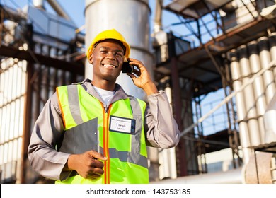 African Oil And Chemical Worker Talking On Cell Phone