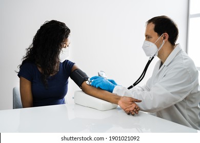 African Patient Blood Pressure Check Up Wearing Face Mask