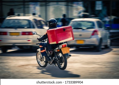 African People  Delivery Man On A Motorcycle, Urban Scene