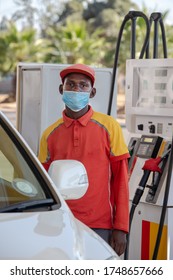 African Petrol Attendant Wearing A Mask At A Gas Station In Botswana