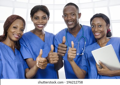 African Physician Team Thumbs Up, Studio Shot