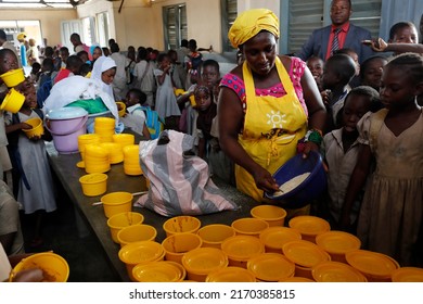 African Primary School Sponsored By French NGO : La Chaine De L'Espoir. Food Distribution.  Lome. Togo.  05-30-2019