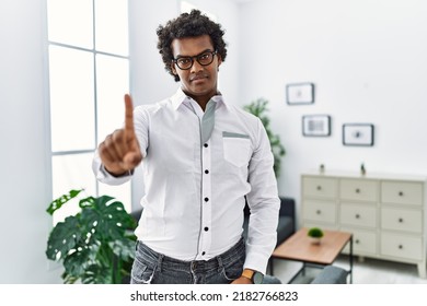 African Psychologist Man At Consultation Office Pointing With Finger Up And Angry Expression, Showing No Gesture 