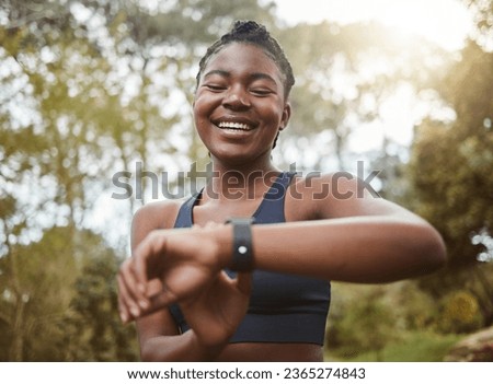 African runner woman, smart watch and park for check, smile or happy for time, results or fitness in nature. Girl, iot clock and monitor for speed, heart rate or smile for exercise, workout or health
