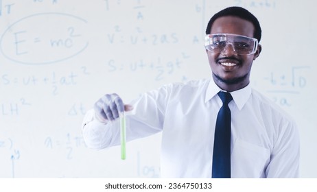 African scientists are conducting experiments on chemicals for medical use while wearing safety gloves and goggles. - Shutterstock ID 2364750133