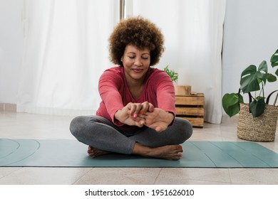 African Senior Woman Doing Yoga At Home - Healthy Lifestyle And Mindfulness Elderly Concept - Focus On Face