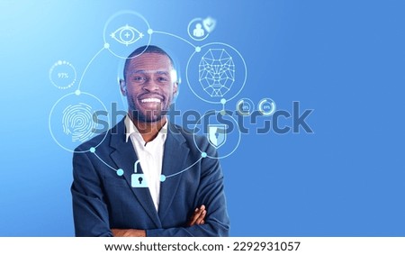 African smiling businessman and digital biometric scanning with security. Face detection and personal information hologram. Concept of AI, data protection and facial recognition