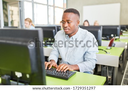 African student learns in computer course at university