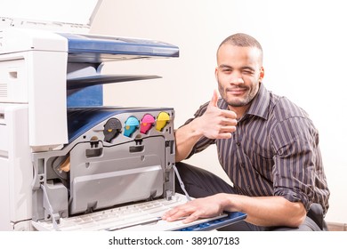 African Technician Fix Office Photo Copier