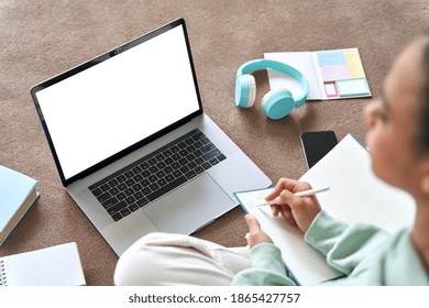 African Teen School Girl Student Virtual Distance Learning Online Classes Looking At Mock Up White Blank Empty Laptop Mockup Monitor Screen Remote Digital Elearning At Home. Over Shoulder View.