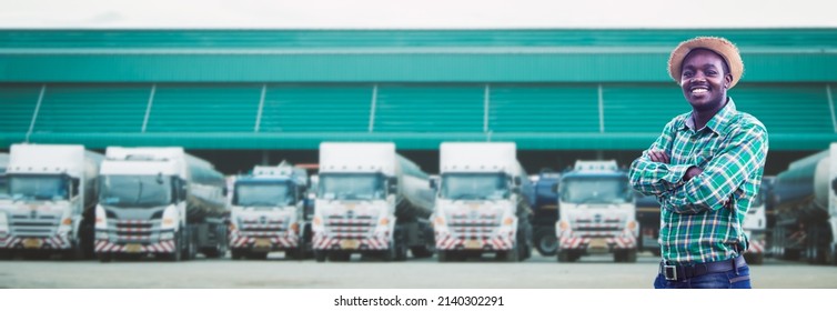 African Truck Driver Standing And Smiling Confident In Insurance Cargo Lorry In Long Transportation And Delivery Business