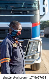 African Trucker Wearing A Mask, Outdoors View In The Back Of A Truck, In The Street