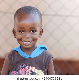 african village, happy african child, outdoors in the yard