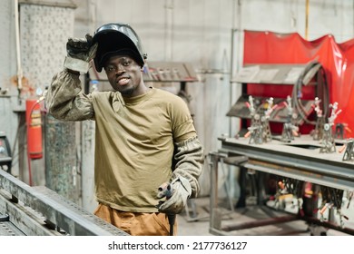 African welder working with metal products