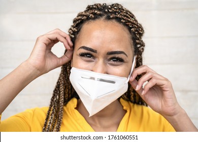 African Woman With Braids Wearing Face Medical Mask - Young Girl Using Facemask For Preventing And Stop Corona Virus Spread - Healthcare Medical And Youth Millennial People Concept 