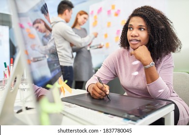 African woman as graphic designer in training on tablet computer - Shutterstock ID 1837780045