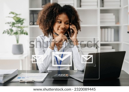 African Woman hands using Laptop, tablet typing on keyboard and surfing the internet with email icon, email marketing concept, send e-mail or newsletter, online working internet network technology.

