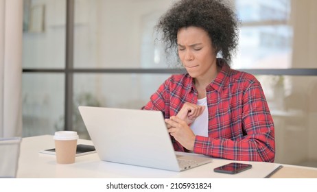 African Woman Having Wrist Pain While Using Laptop