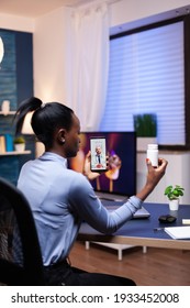 African Woman Listening Health Care Physician Talking During Online Consultation Late At Night. Black Patient In A Video Call With Medic Discussing Health Problems Of Woman.