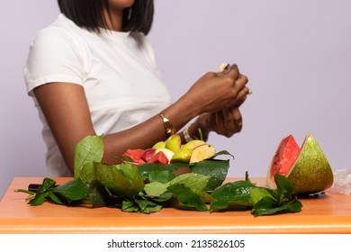 African Woman Making Fruit Salad