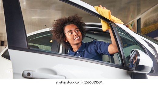 African Woman As A Mechanic Apprentice In The Paint Care Of Car In The Dealership