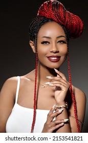  african woman photoshoot with braided hairstyle and sensual look against dark background in studioMay 3, 2022 in Romania