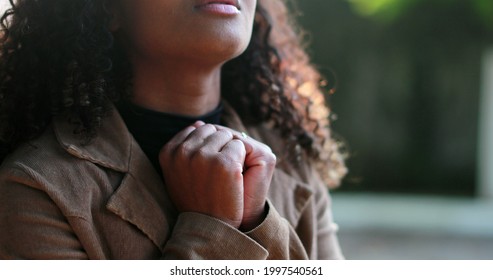 African Woman Praying To God Outside Seeking Faith And HOPE Outside In Sunlight