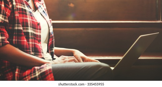 African Woman Searching Internet Sitting On Steps