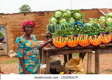 African Woman Selling Fruits And Vegetables At The Farmers Market