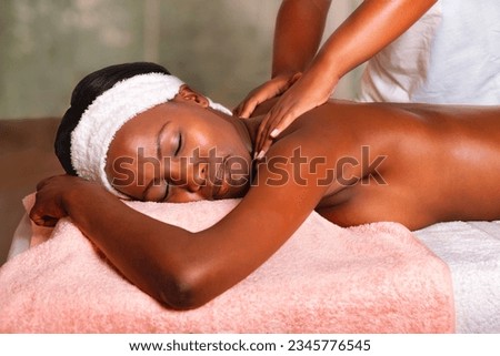 african woman at a spa Centre, having a massage and skin moisturize, pampering session ending with a long nap