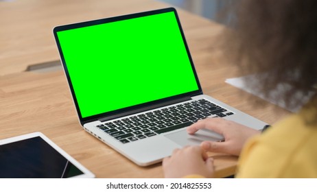 African Woman Using Laptop With Green Chroma Key Screen