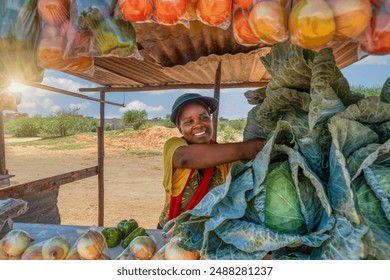 african woman vegetable street vendor, smiling self employed at her street stall selling fresh produce - Powered by Shutterstock