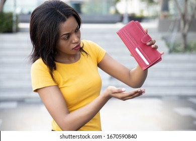 African Woman Without Money. Portrait Of Poor Black African Woman With Empty Wallet, Poor People, Poverty, Bankruptcy, Financial Broke, Unemployment, Joblessness; No Credit, No Money Concept