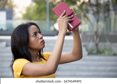 African Woman Without Money; Portrait Of Poor Black African Woman With Empty Wallet, Poor People, Poverty, Bankruptcy, Financial Broke, Unemployment, Joblessness; No Credit, No Money Concept