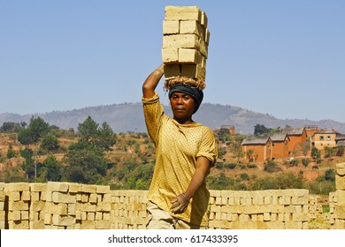 African Woman Working Hard In Brickyard - Madagascar